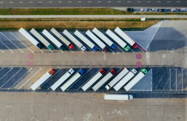 The UK transport sector: lorries parked on a forecourt