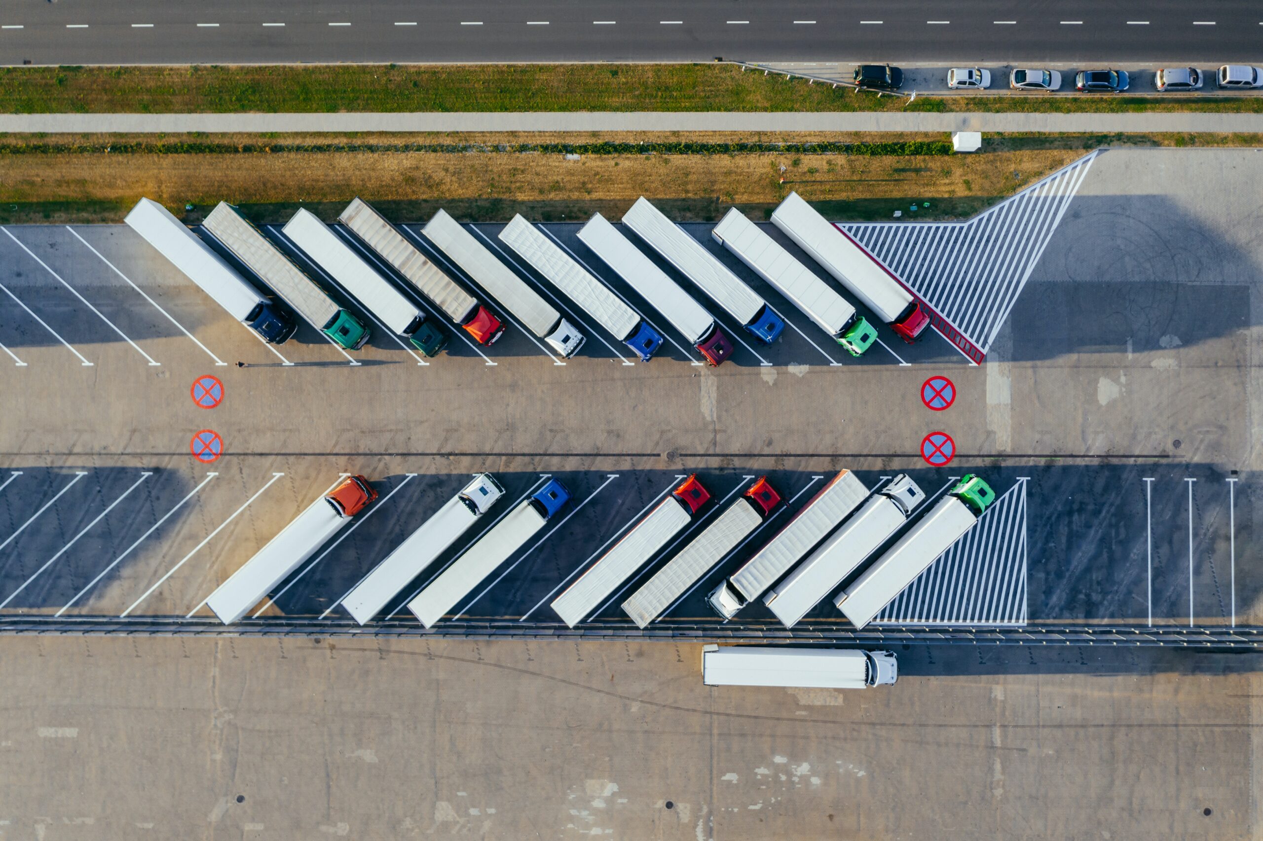 The UK transport sector: lorries parked on a forecourt